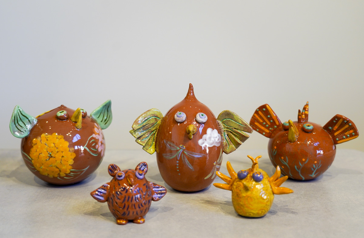 a collection of ceramic birds