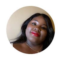 female with slight smile looking at camera