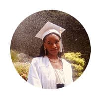 female with slight smile looking at camera