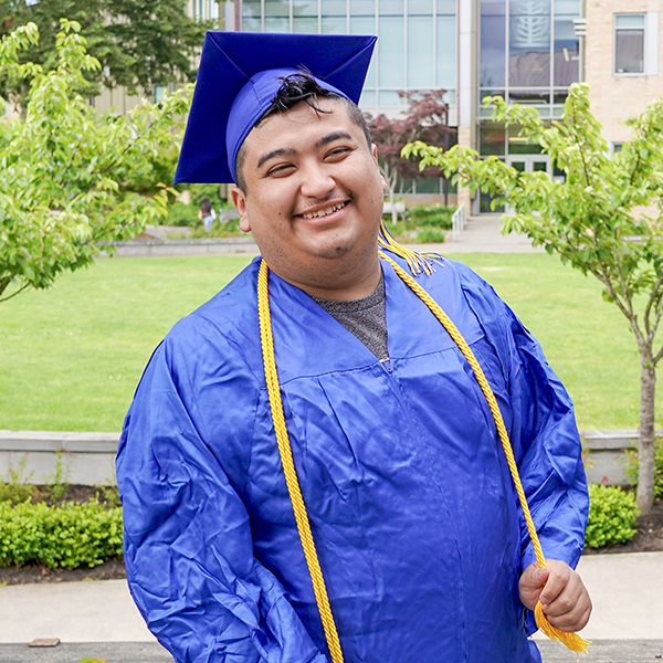 grad wearing blue regalia