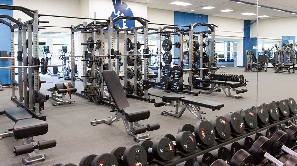 a row of weight-lifting equipment is pictured