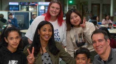 An image of students with their host family