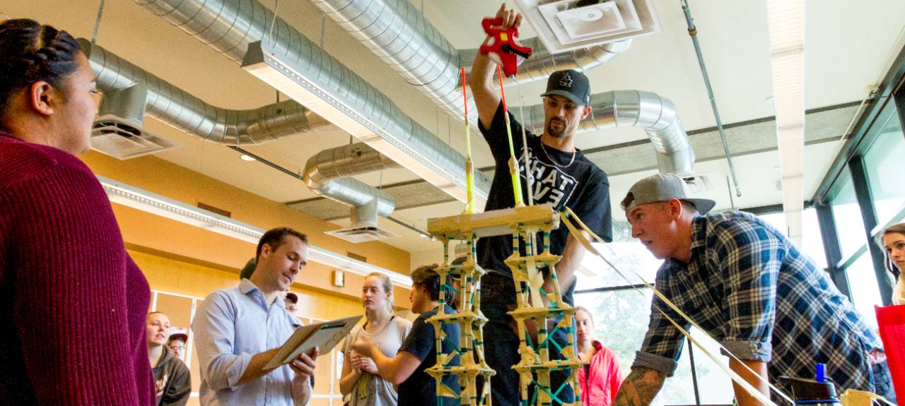 A group of students build a tower